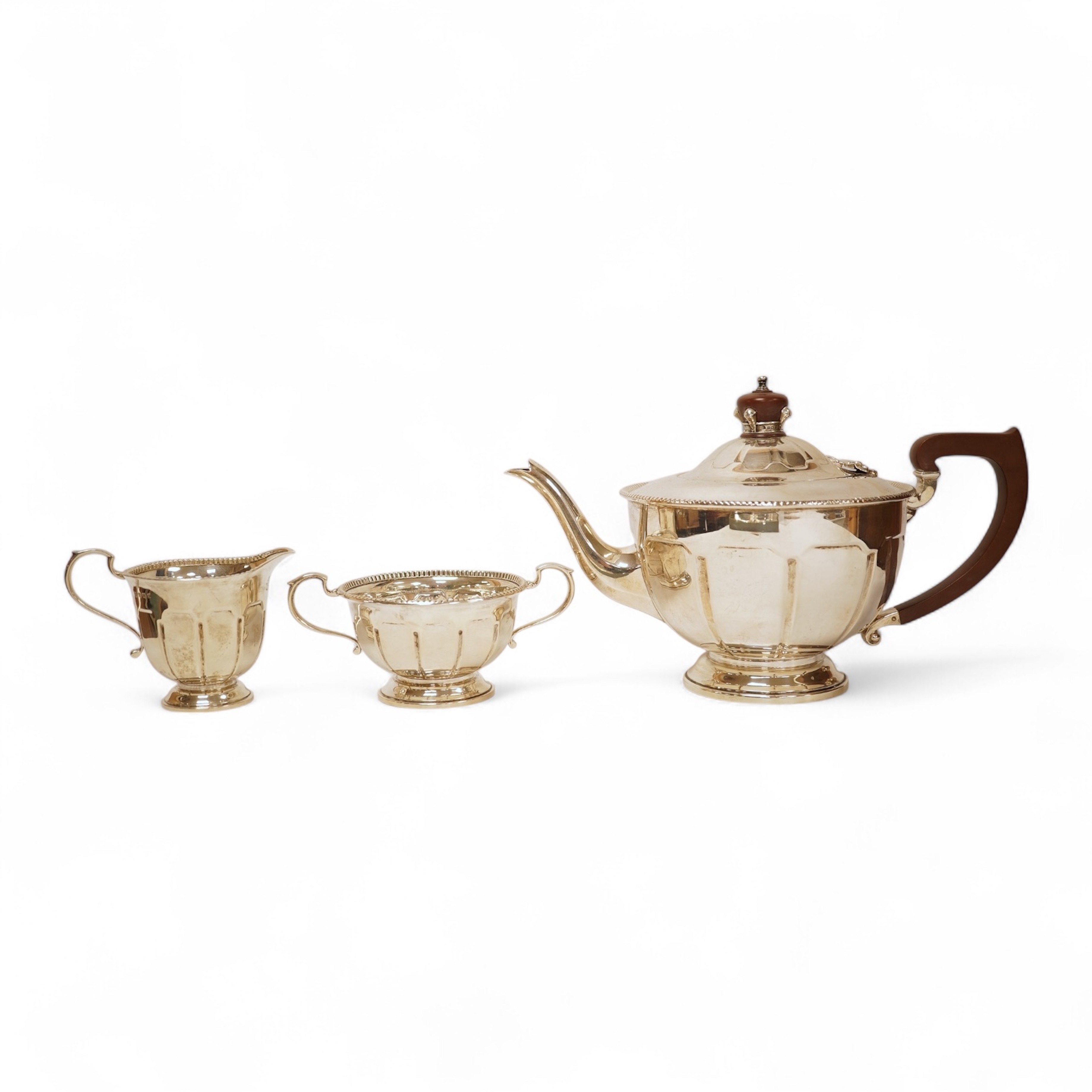 A George V three piece silver tea set by Pearce & Sons & Sons, Birmingham, 1935, gross weight 26.6oz.